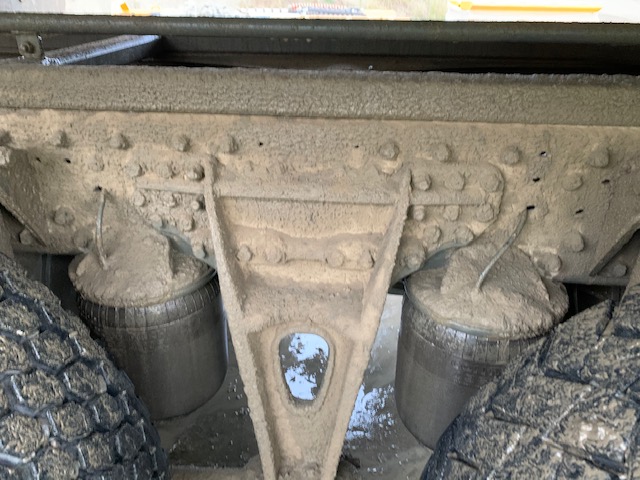 Dirty truck, with chassis caked in dirt and grime